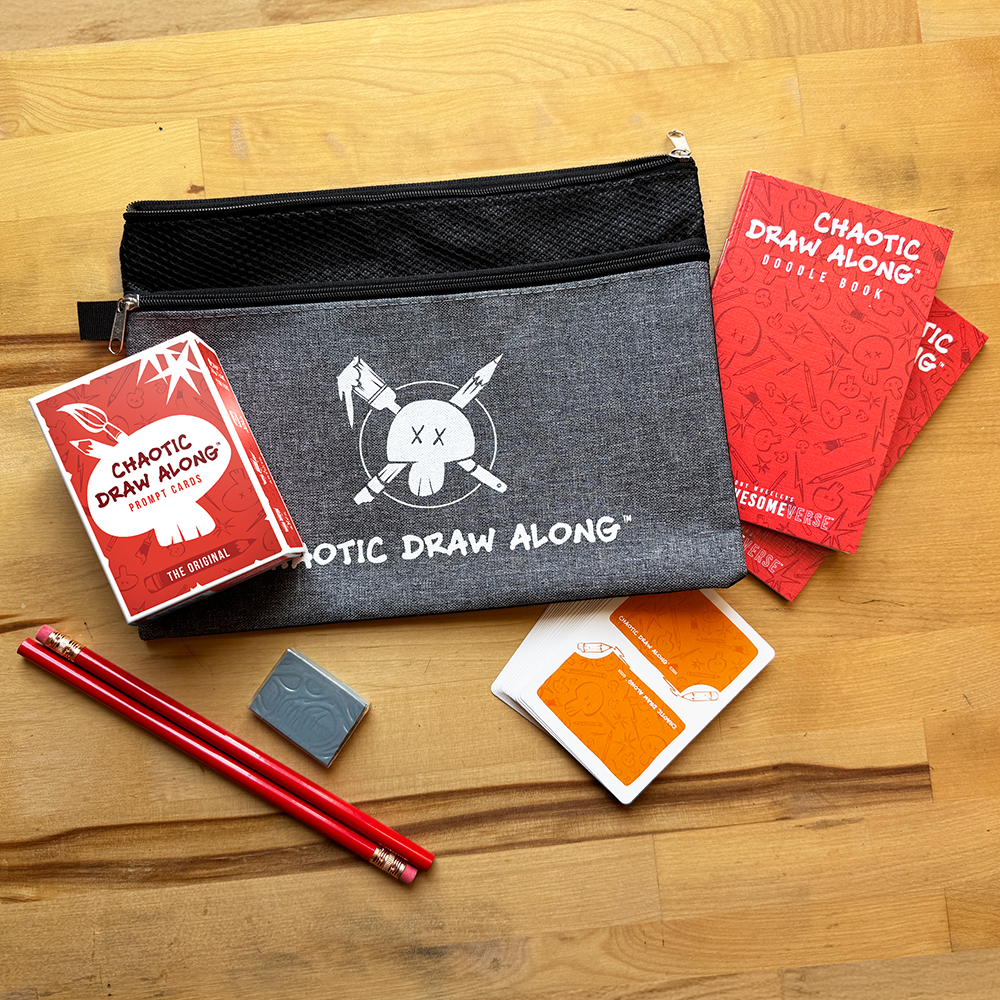 Chaotic Draw Along bundle with prompt cards, doodle books, pencils, eraser, booster cards, and a branded pencil case arranged on a wooden table.