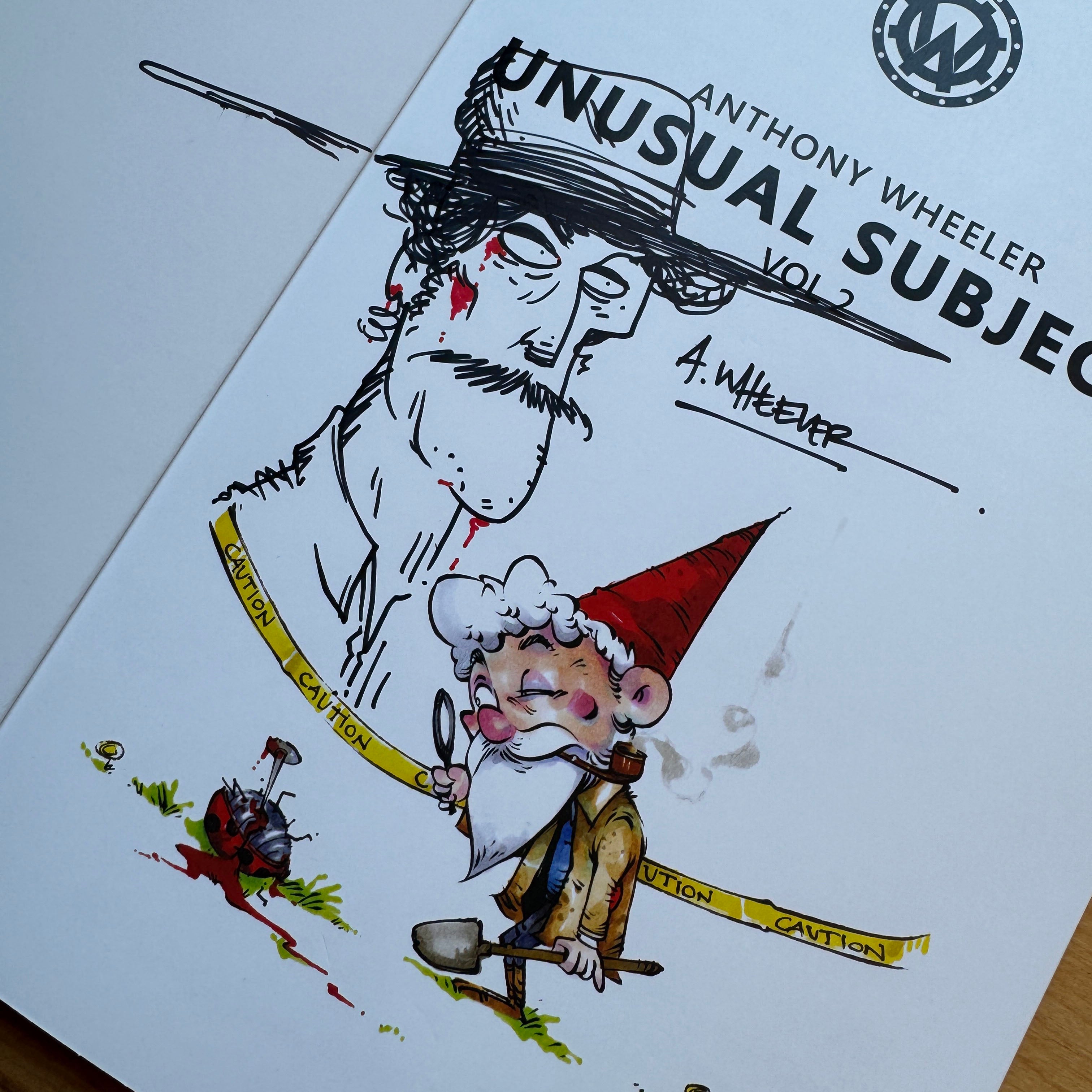 Signed doodle edition of Unusual Subjects Vol. 2 featuring an original cowboy portrait sketch with a fully colored garden gnome illustration.