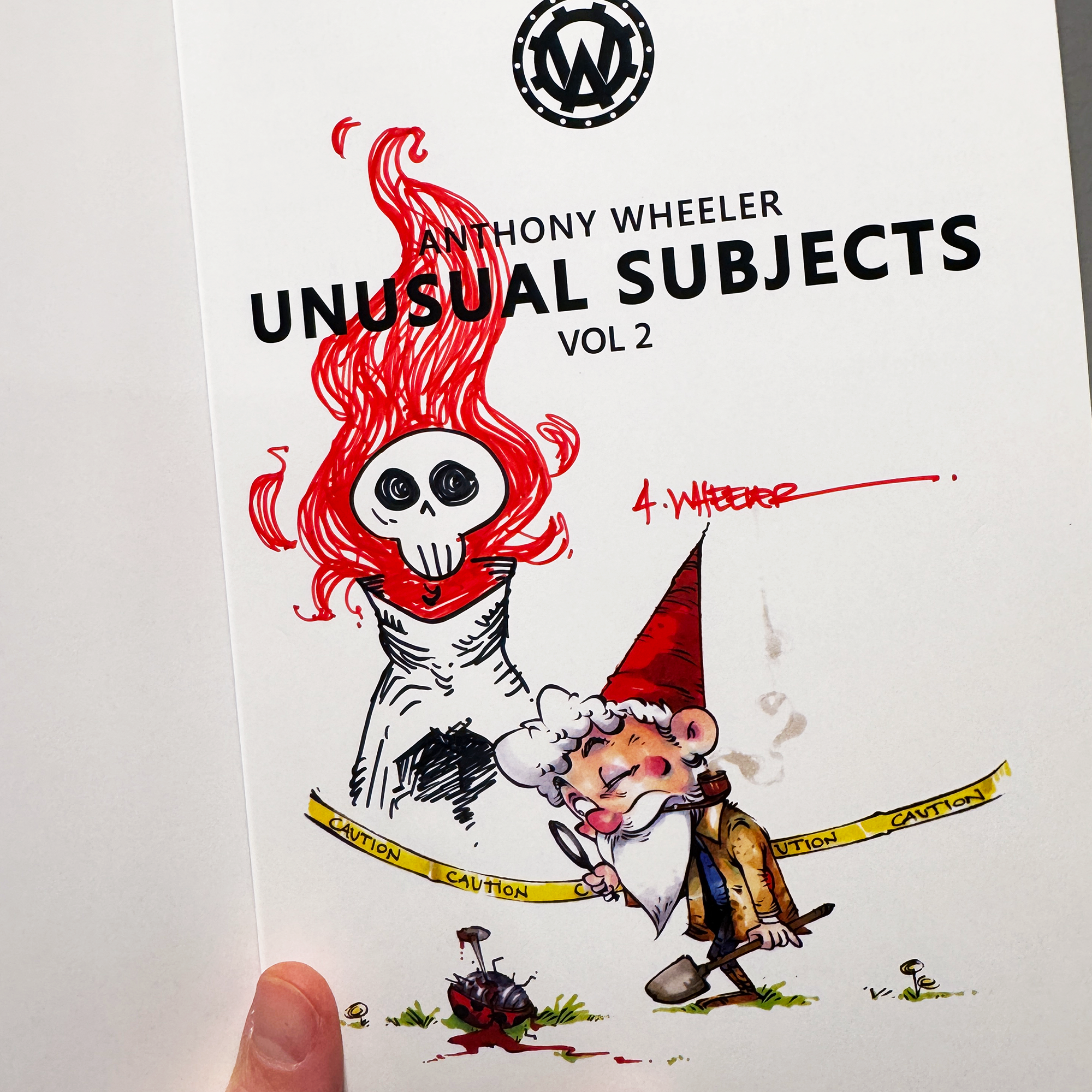 Anthony Wheeler’s Unusual Subjects Vol. 2 book page with a colorful sketch of a flaming skull character and gnome investigator.