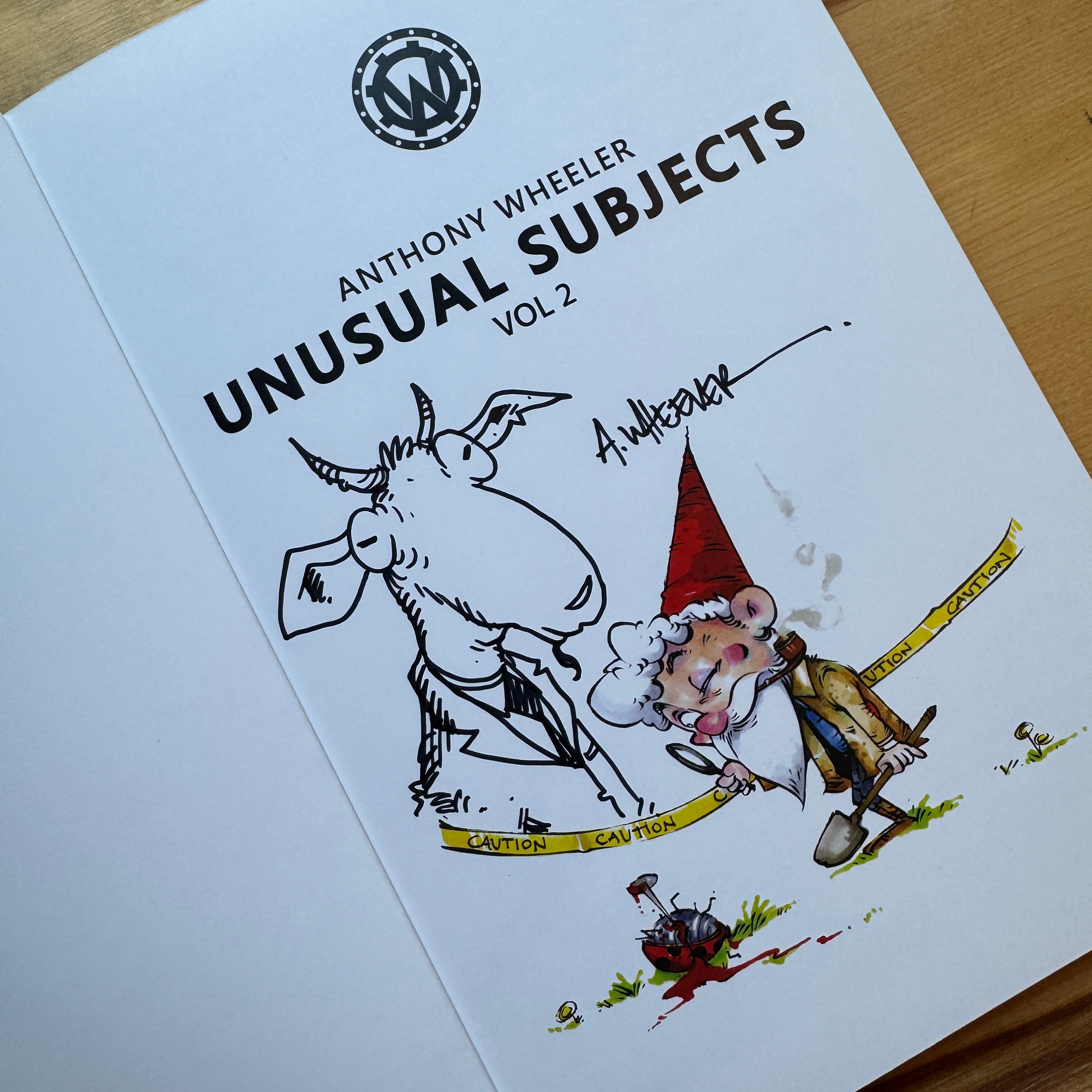 Signed doodle edition of Unusual Subjects Vol. 2 featuring an original goat sketch alongside a fully colored garden gnome illustration.
